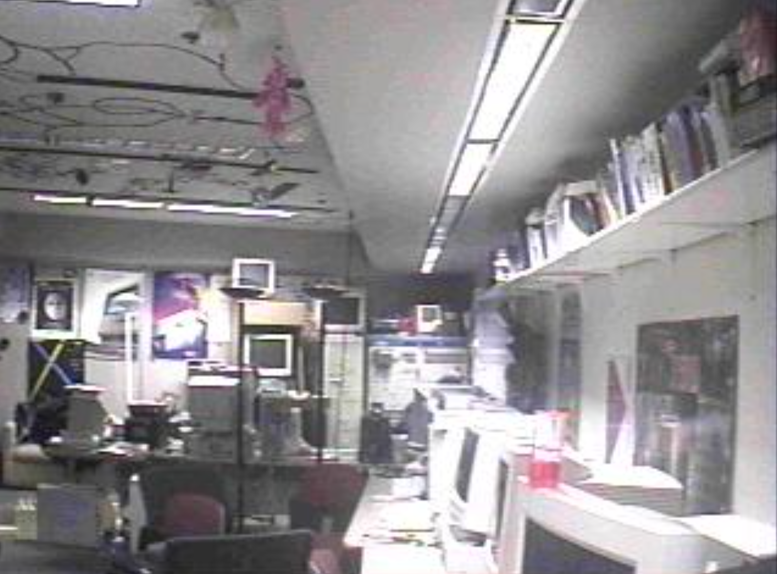 A grainy image featuring an interior view of the UPL, a triangular-shaped undergraduate lab at UW-Madison.